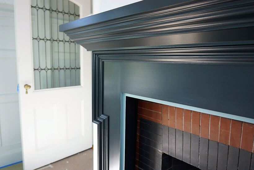 blue fireplace mantel in formal dining room