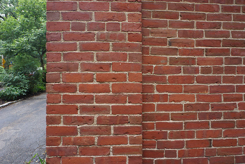 exposed brick foundation on historic home in brookline, ma