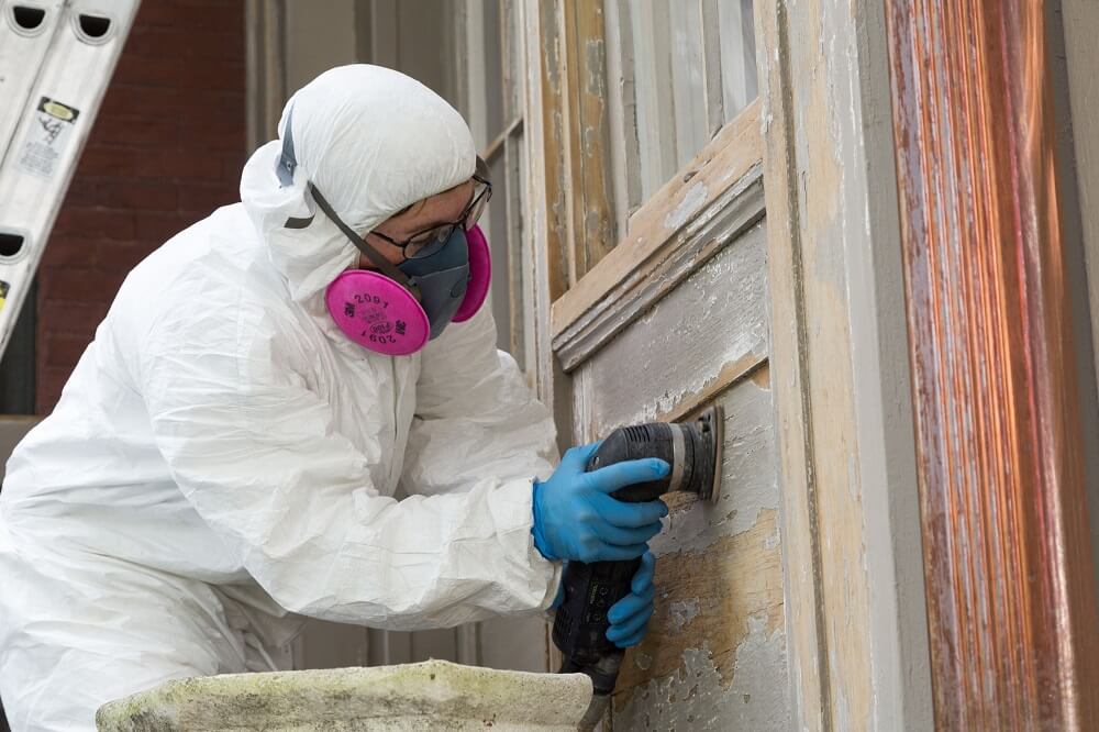 A Catchlight Painting employee wearing protective gear while working to ensure safety first.