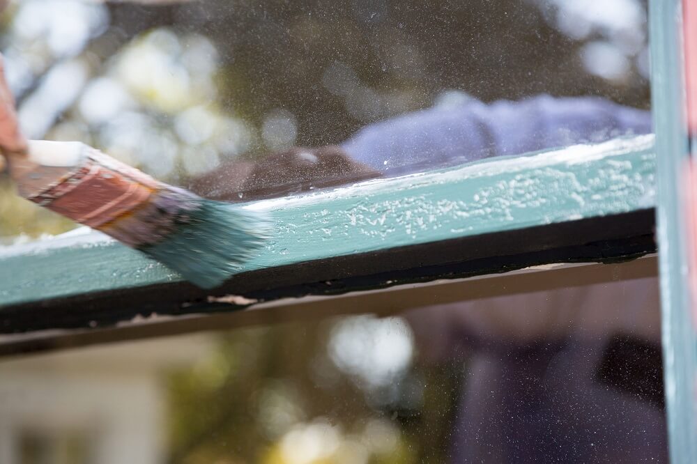 Bubbles under paint on a windowsill