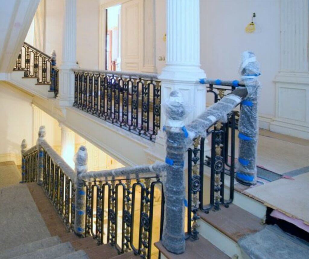 magnificently detailed wrought iron railing protected