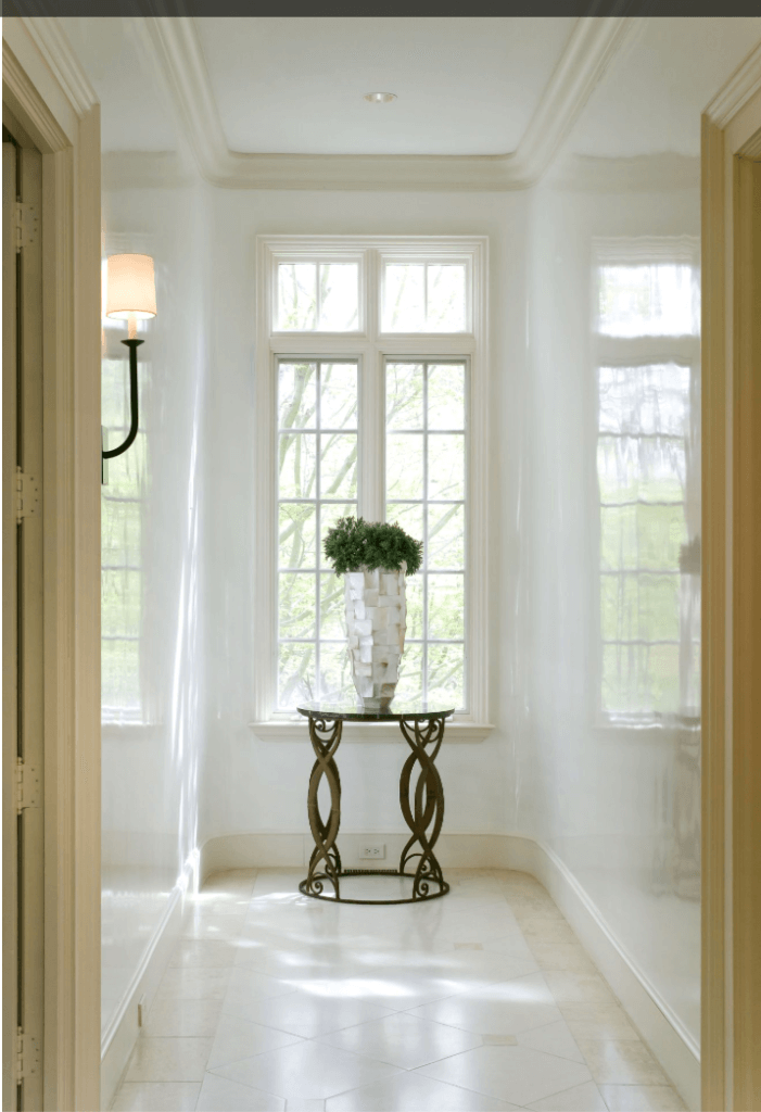 Choosing white interior paint for a foyer can be a bold choice.