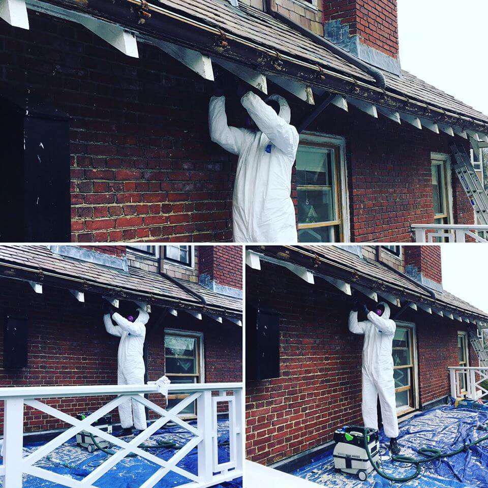 Catchlight Painting employee working on roof outside of a home