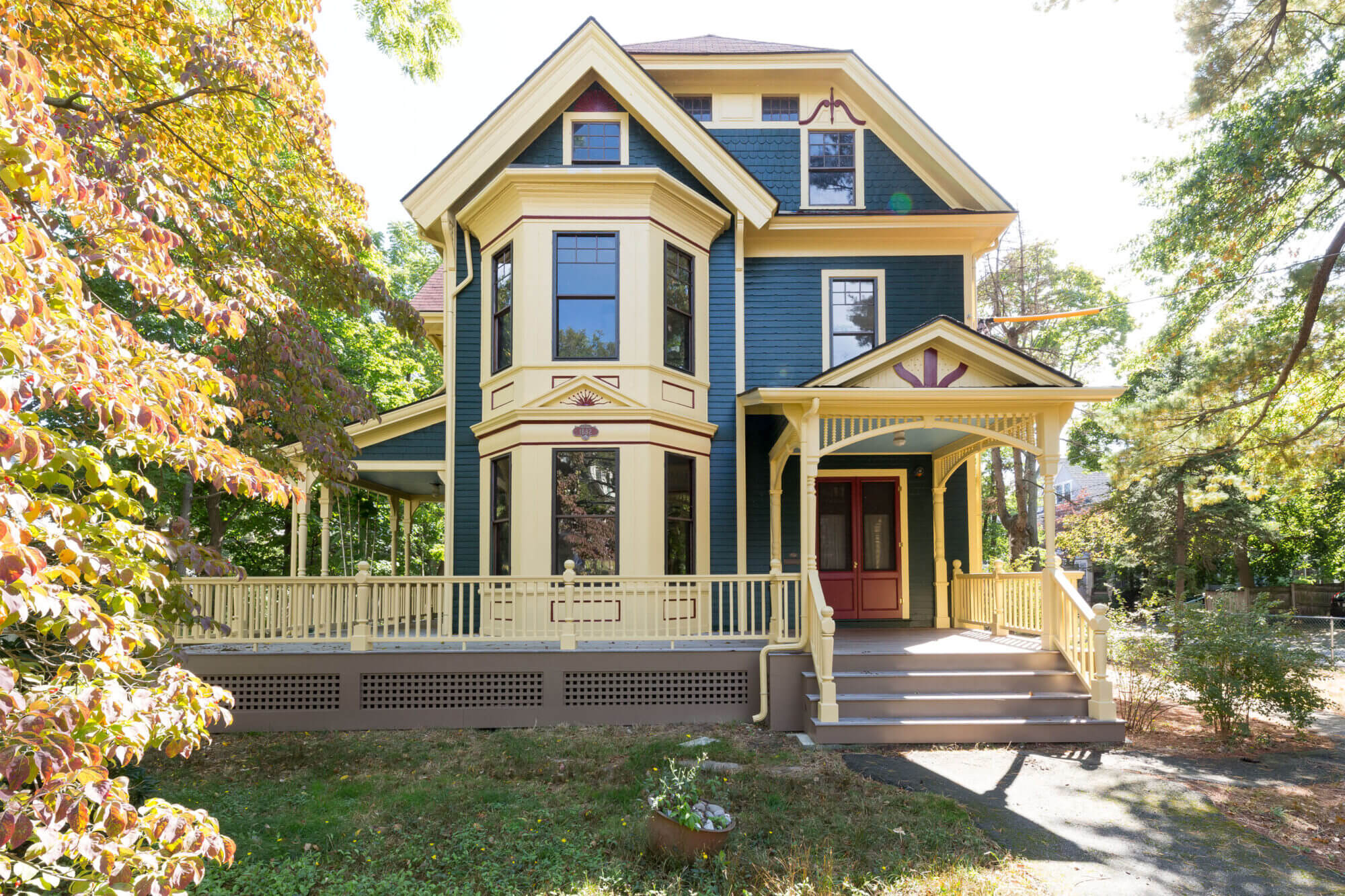 Full image with an exterior front view of the historic Victorian home