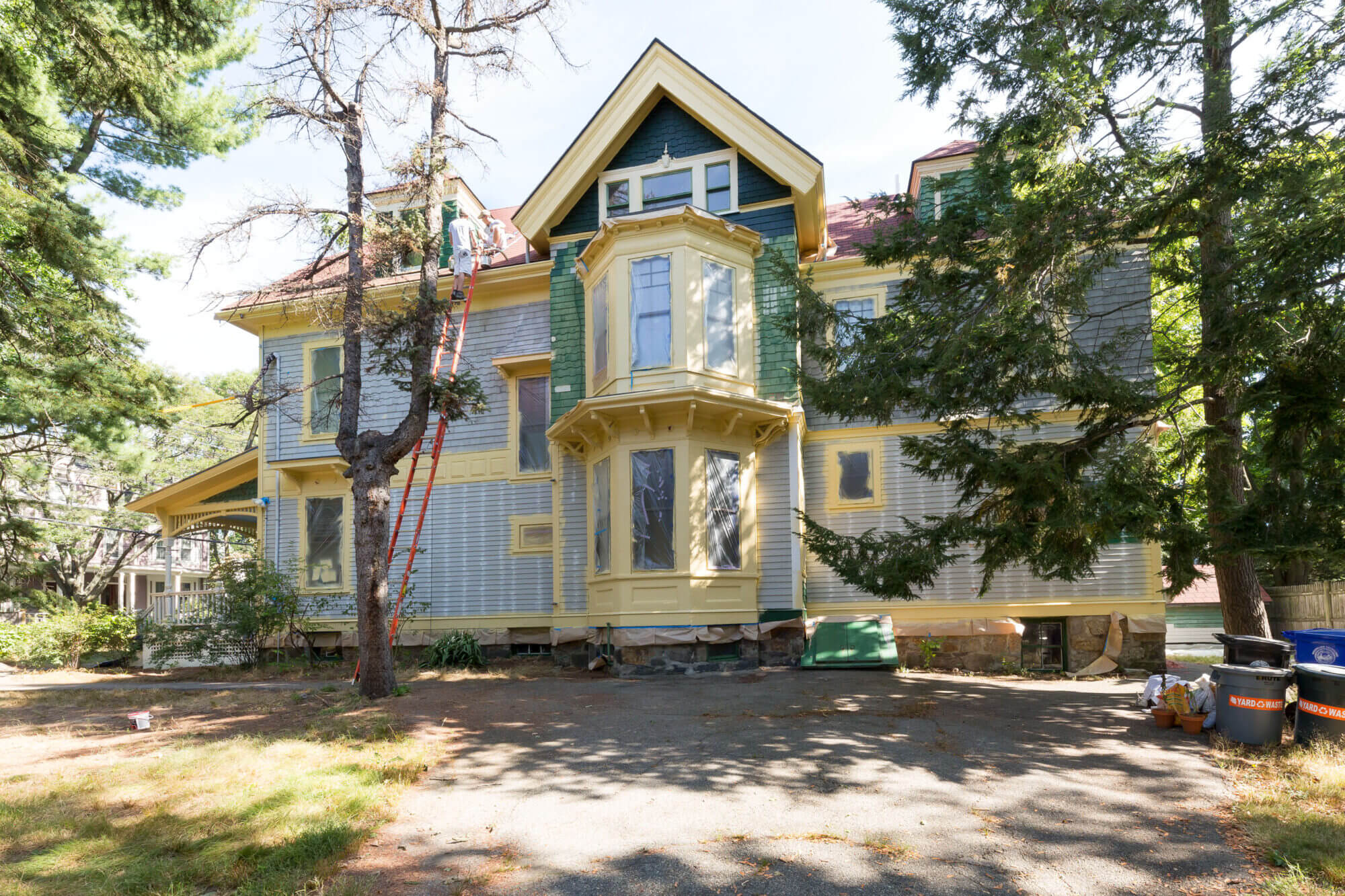 exterior view of home being prepared for painting