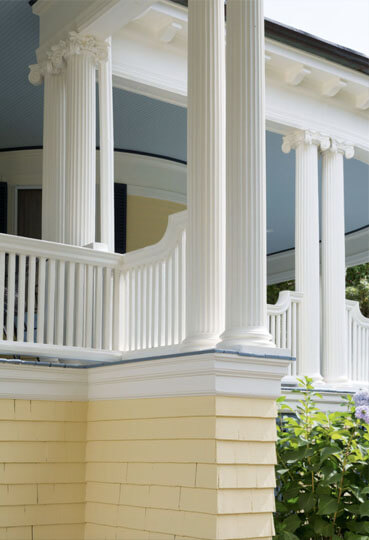 beautiful porch outside of home painted in yellow and blue