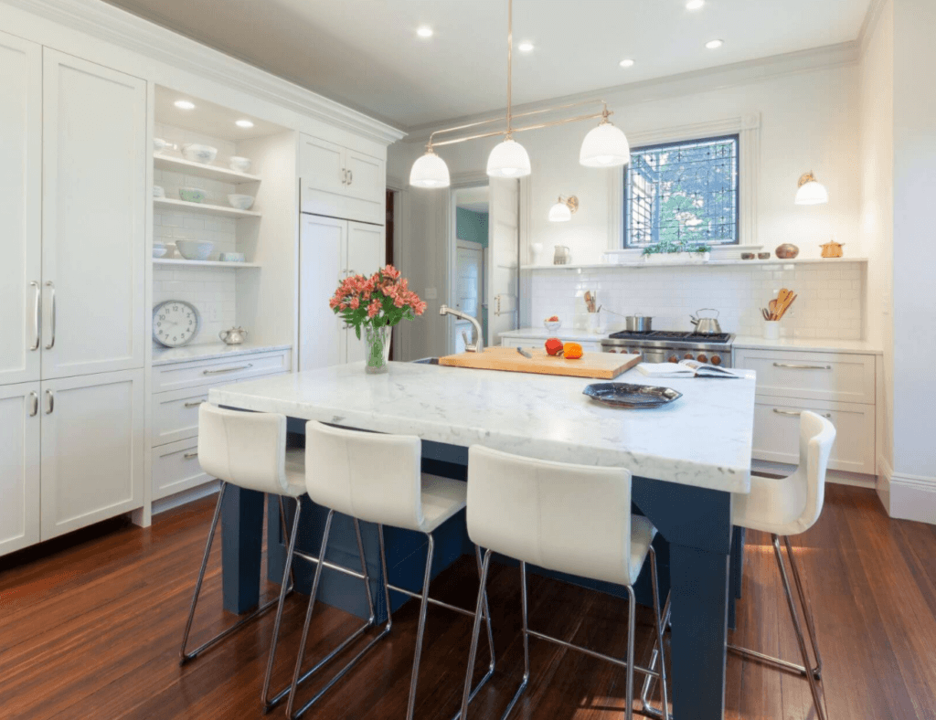 historic color scheme with blue kitchen island in an old kitchen